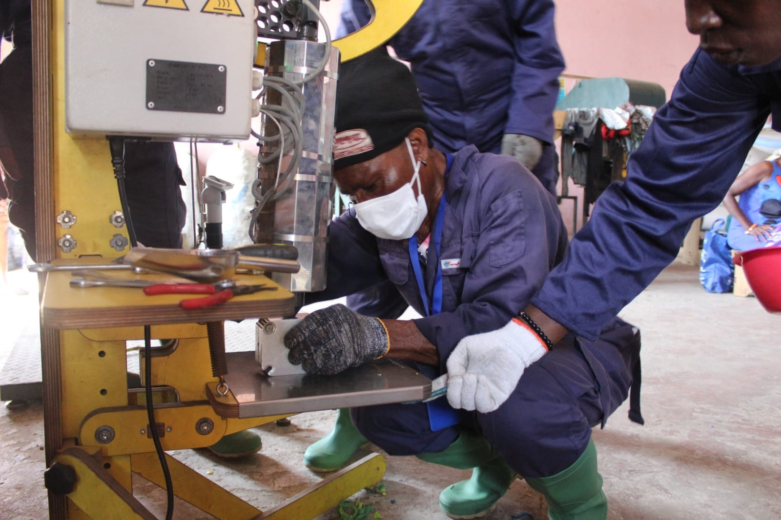 Green Skills Training in Ghana | Lady working on machine to obtain Green Skill readiness